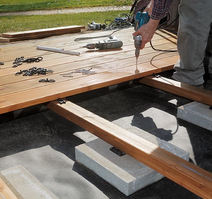Construction of outdoor deck with tools.