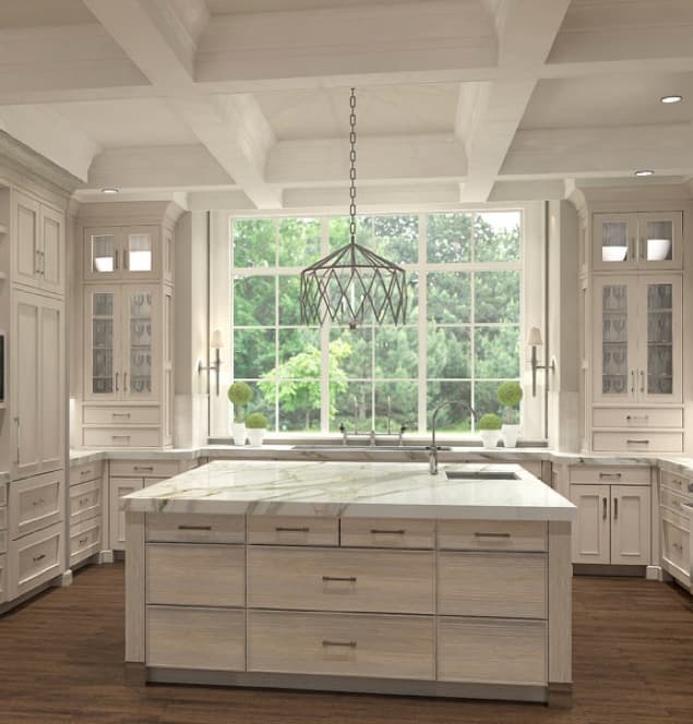 Marble kitchen island with sink and cabinets.